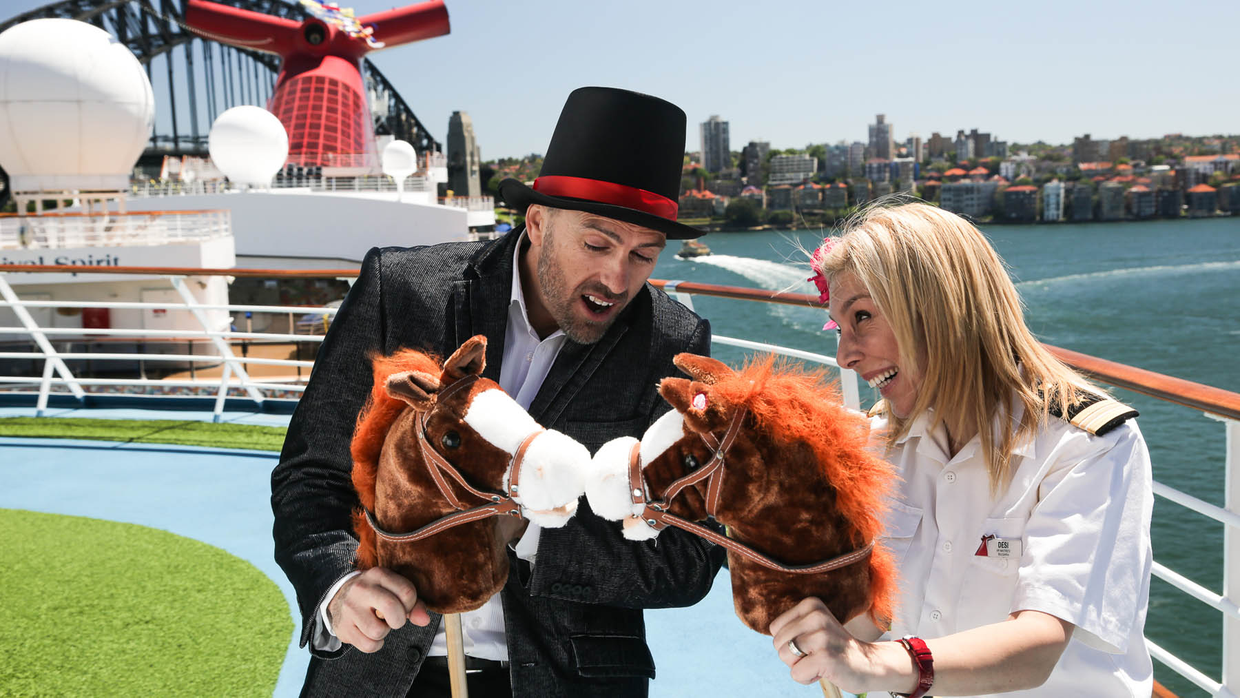 Cruise Director Eli and Senior Maitred Dessi compare horses