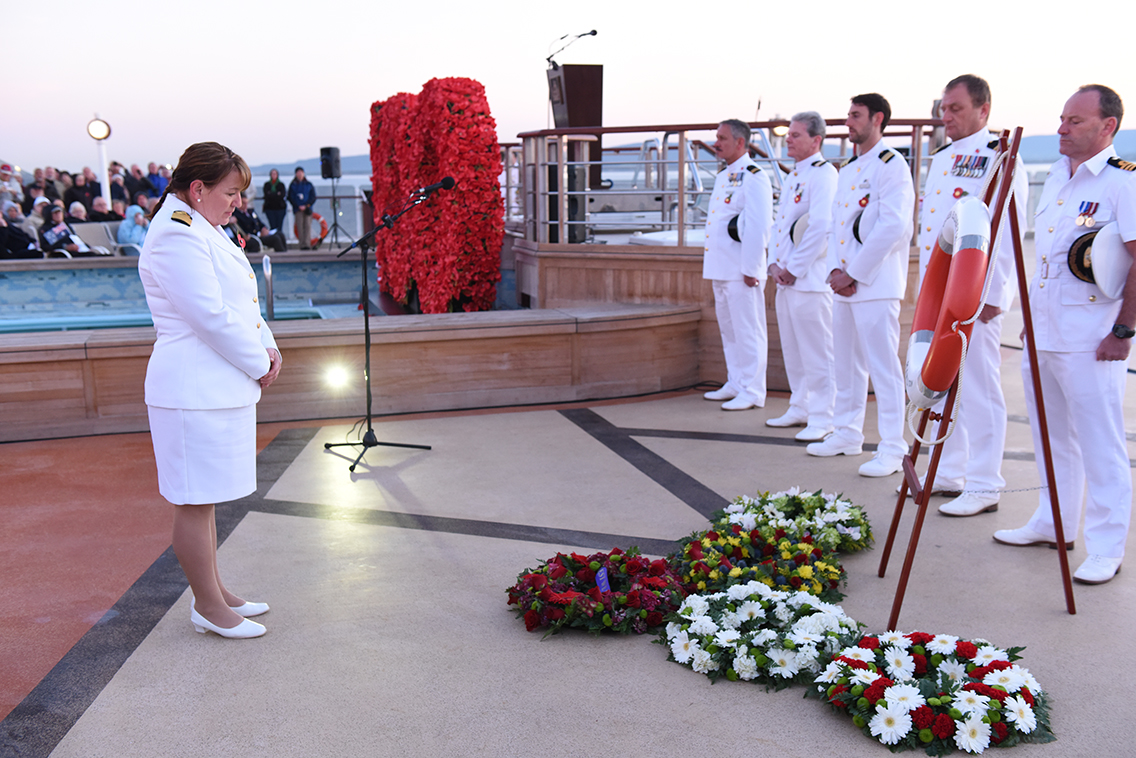 Queen Elizabeth Captain  Inger Klein Thorhauge pays her respects at the Anzac dawn service onboard the ship at Gallipoli
