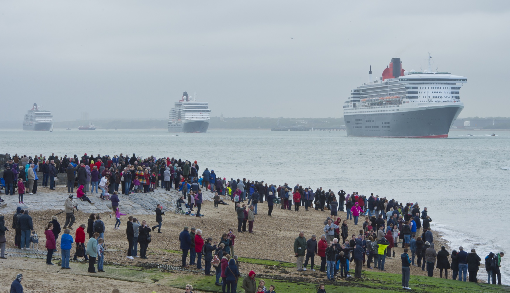 Spectators watch as Cunards three Queens depart Southampton marking 175 years May 3 2015 Credit Cunard - James Morgan