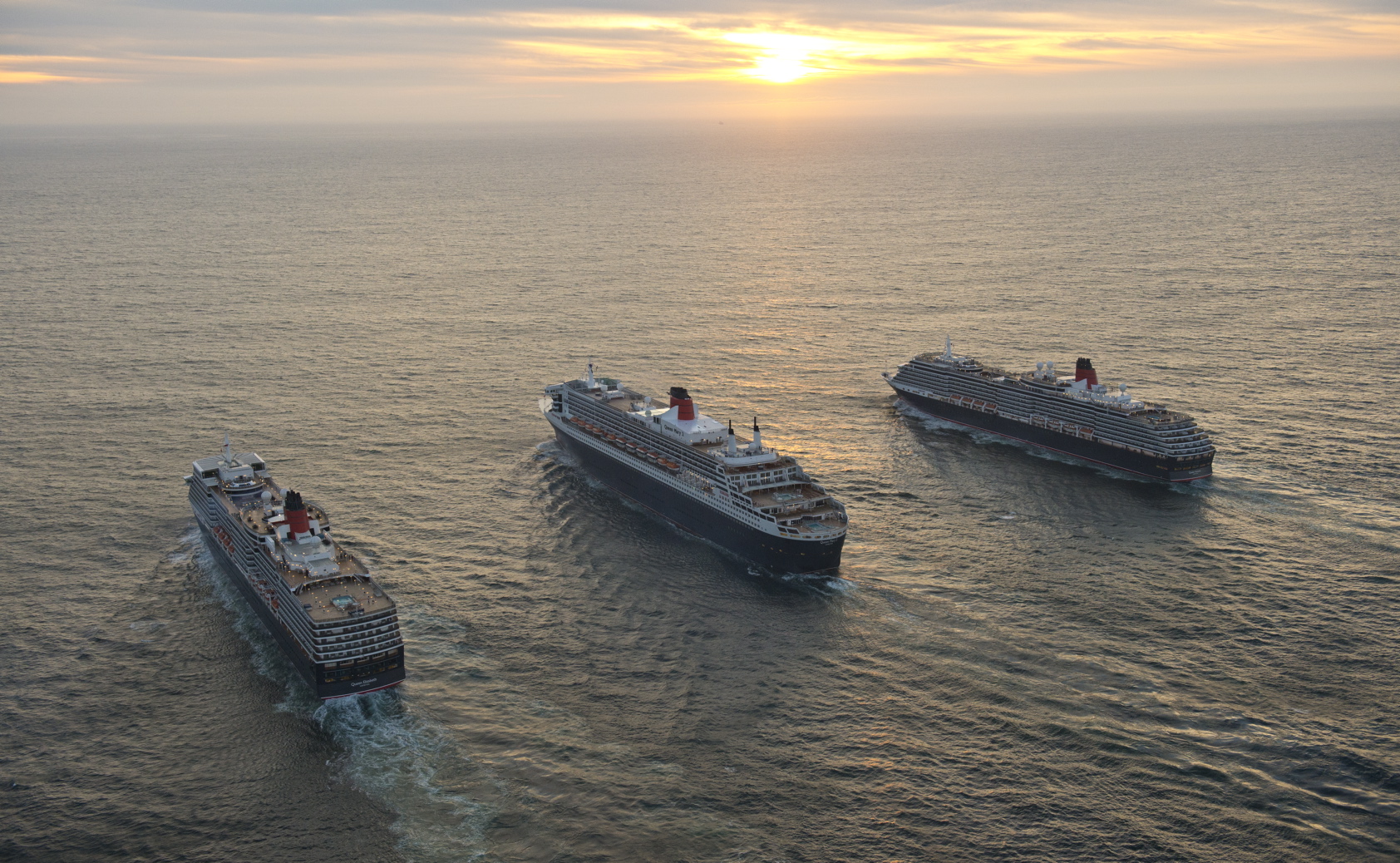 To mark Queen Mary 2s 10th anniversary the liner sails alongside Queen 1