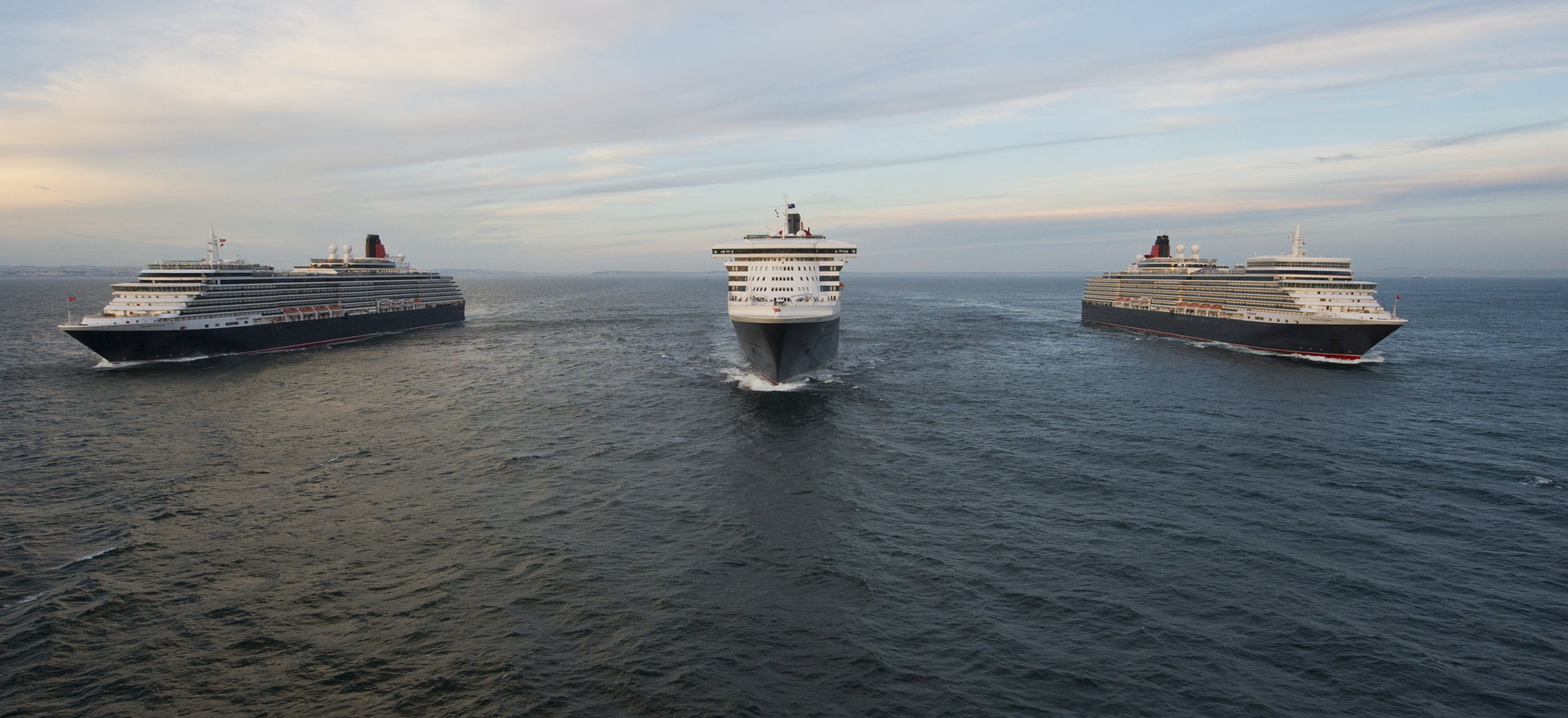 To mark Queen Mary 2s 10th anniversary the liner sails alongside Queen 2